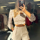 BEIGE ANIMAL PRINT CUTOUT TOP (size medium left)