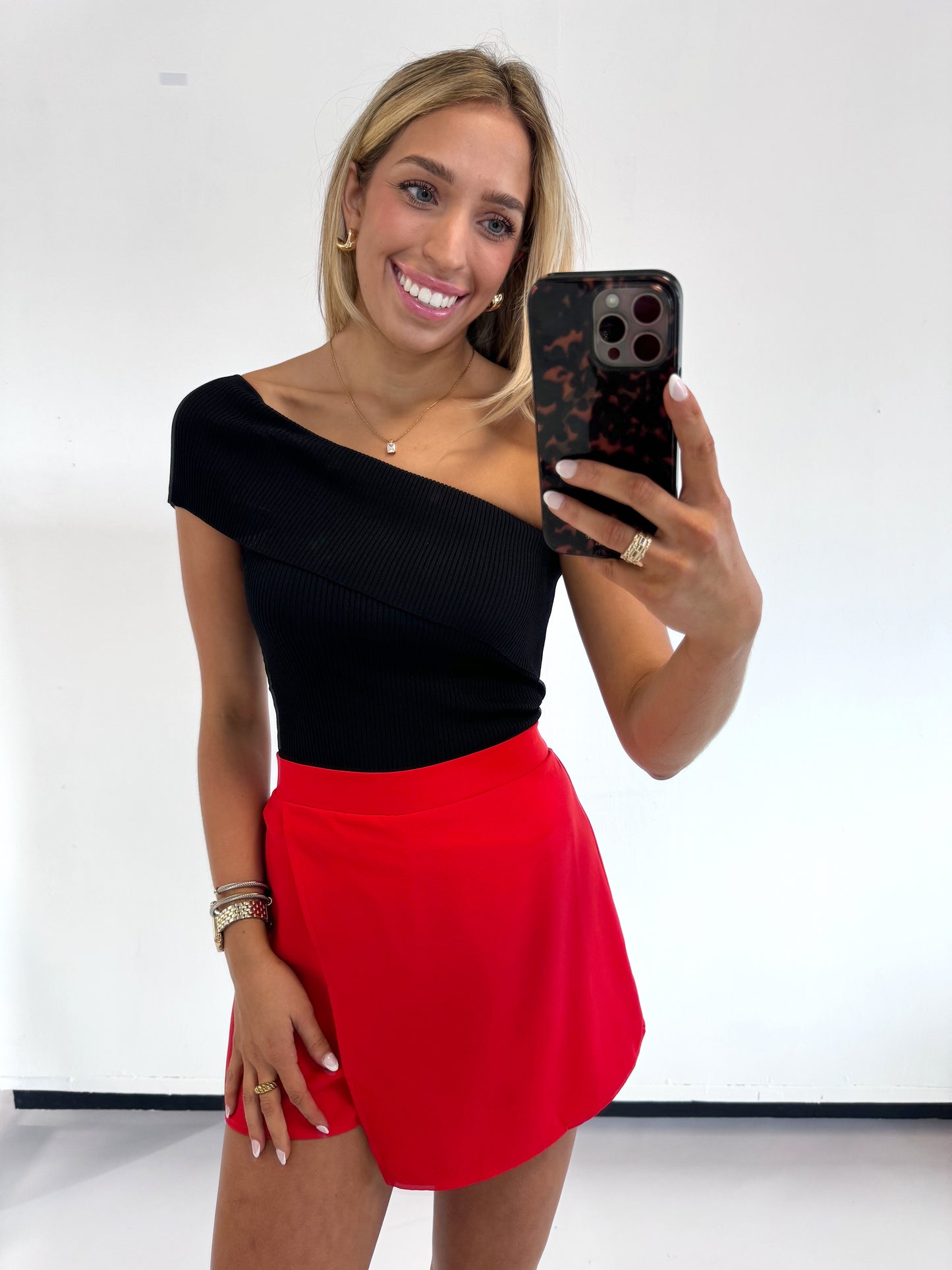 RED ASYMMETRICAL OVERLAY SKIRT